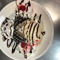 Ice Cream Truffles · Served with an extra scoop of ice cream, whipped cream, chocolate syrup, and 2 cherries on t...