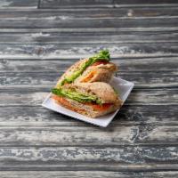 Turkey Sandwich · Turkey, dill Havarti cheese, green leaf lettuce, and sliced tomatoes, served on a whole grai...