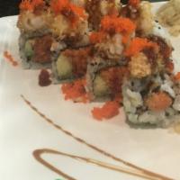 Dynamite Maki · 8 pieces. Spicy tuna, avocado and shrimp tempura topped with eel sauce, masago. Spicy.