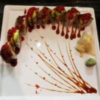 Superonic Maki · 8 pieces. Raw. Spicy scallop, crunch, cucumber, topped with eel, avocado, tobiko and eel sau...