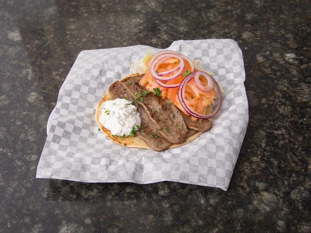 Mediterranean Gyro Sandwich · Pita bread, fresh lettuce, tomatoes, grilled onions and tzatziki sauce.