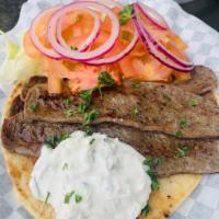 Mediterranean Gyro Sandwich Meal · Pita bread, fresh lettuce, tomatoes, grilled onions and tzatziki sauce. Includes fries and d...