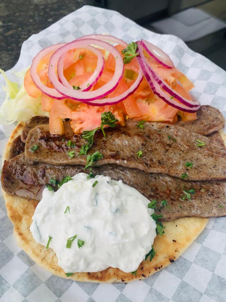 Mediterranean Gyro Sandwich Meal · Pita bread, fresh lettuce, tomatoes, grilled onions and tzatziki sauce. Includes fries and drink.