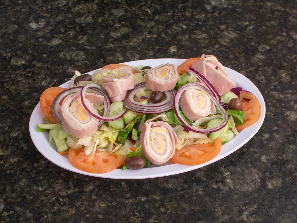 Chef's Salad · Lettuce, tomatoes, cucumbers, red onions, turkey, ham and cheese tossed with house dressing.