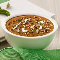 Dal Makhni · The harmonious blend of black lentil, red kidney beans tomatoes, ginger finished with cream and served with a dollop of unsalted butter. Come with Rice