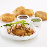 Aloo Tikki chaat · Crisp and browned spiced potato patties served with spicy North Indian chickpea.