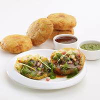 Aloo Tikki (2 Pc) · Crisp and browned spiced potato patties served with spicy North Indian chickpea.
