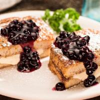 Stuffed French Toast · 2 slices of thick New Orleans sourdough, egg dipped and golden grilled then stuffed with swe...