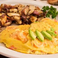 The Louisiana Omelet · Shrimp and tomatoes topped with avocado and creamy hollandaise sauce.