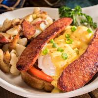 Cajun Benedict · 2 poached eggs over grilled andouille sausage, sliced tomatoes and our toasted sourdough top...