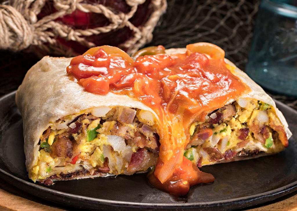 Huck's Breakfast Burrito · Your choice of grilled ham, sausage, bacon or andouille sausage tossed with bell peppers, onions, scrambled eggs, cheddar cheese and country reds rolled inside a warm tortilla topped with creole sauce or Huck's chili.