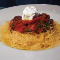 Spaghettini · Served with goat cheese, arugula, black olives, capers, and tomatoes. Rich tomato sauce with...