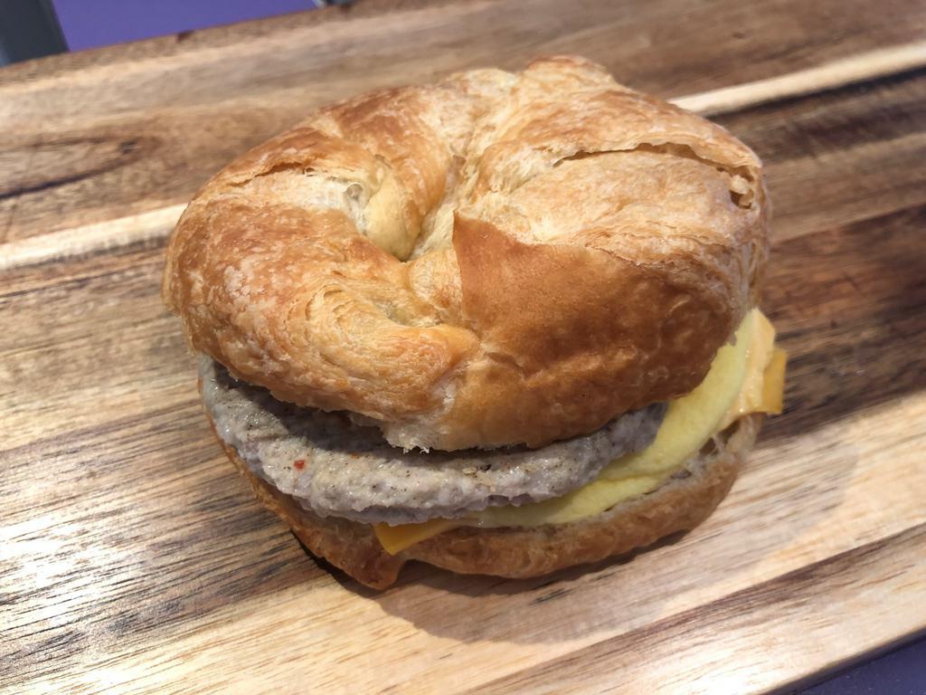 Sausage, egg and cheese sandwich · 2 oz sausage and a slice of American cheese on a house made croissant