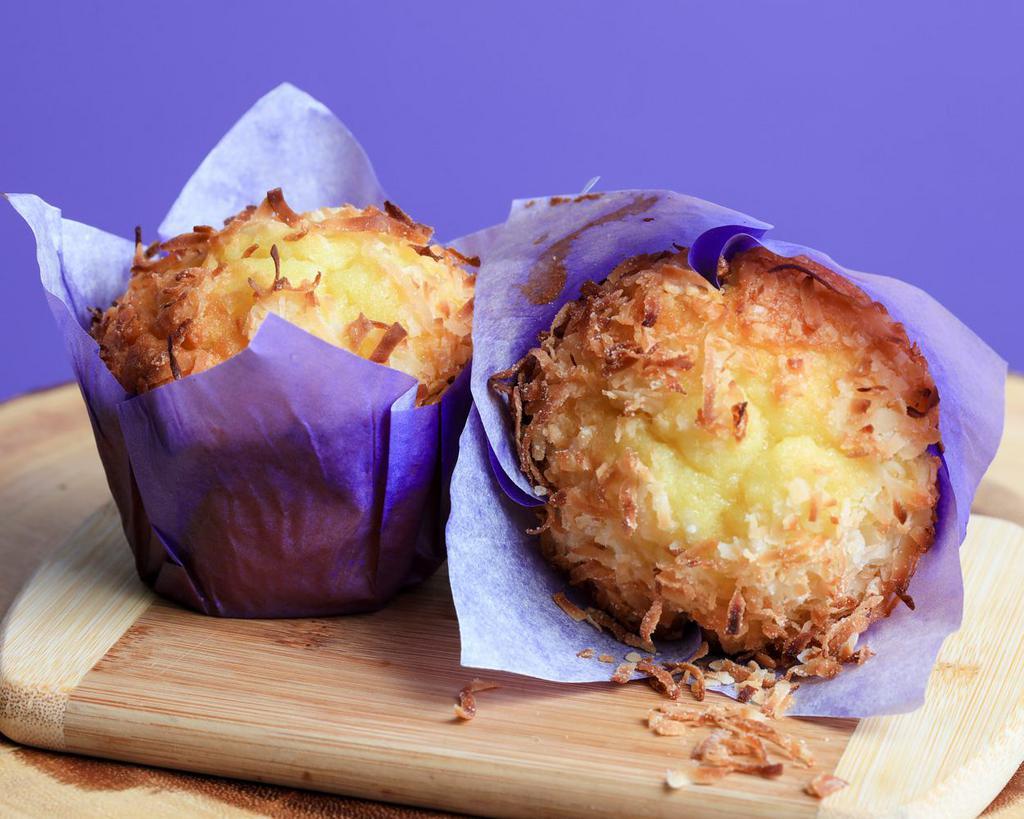 Pineapple coconut muffin  · pineapple with a coconut topping muffin
