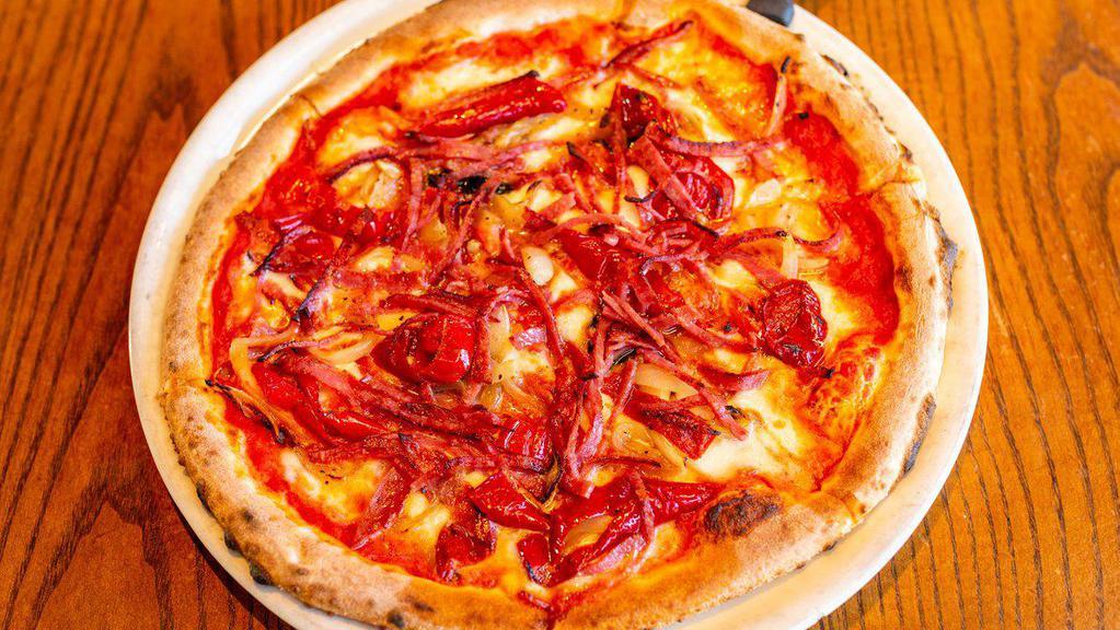 Pizza Calabria · Mama lil's mild peppers, calabrian salame, roasted sweet onions, mozzarella, San marzano passata, and parmigiano.