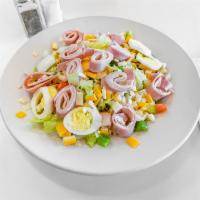 Chef Salad · Romaine lettuce, ham, turkey, Swiss cheese, tomatoes, peppers, onions and choice of dressing.