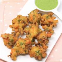 Vegetable Pakoras · Vegetables dipped in spiced chickpea battered and fried