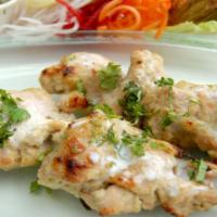 Chicken Garlic Kabab · Chicken breast marinated in yogurt, garlic, fresh herbs and cilantro. Smoked over mesquite i...