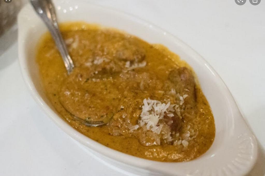 Royal Lamb Malai · Low-fat cuts of lamb cooked with creamed curry, cashew and almond paste, nuts, raisins and spices. Curry is a blend of onions, tomatoes, garlic, gingers, spices and herbs. With imported basmati rice.