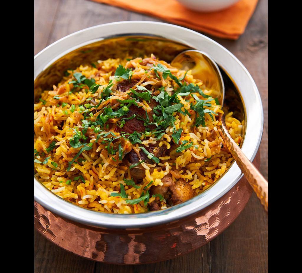 Chicken Biryani · Basmati rice cooked with chicken, herbs and spices 