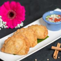 Vegetable Curry Puff (A5) · Pastry filled with potatoes, onions, kabocha, string beans, peas, carrots with curry seasoni...
