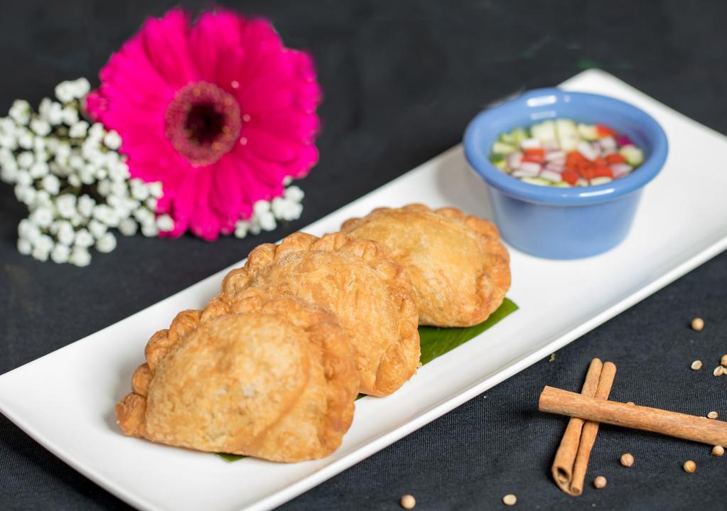 Vegetable Curry Puff (A5) · Pastry filled with potatoes, onions, kabocha, string beans, peas, carrots with curry seasoning.