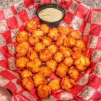 Spicy Cheese Balls · Tasty bites of jalapeno, cheese battered and fried. Served with horseradish sour cream.