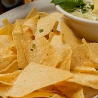 Spinach and Cream Cheese Dip · Our homemade spinach and cream cheese dip served with chips.