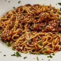 Spaghetti Bolognese Dinner · Spaghetti pasta tossed in our homemade meat sauce. Comes with your choice of tomato basil so...