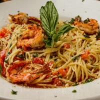 Spaghetti Caprese with Blackened Shrimp Dinner · Spaghetti pasta tossed in olive oil, garlic, tomatoes, basil, crushed red peppers topped off...