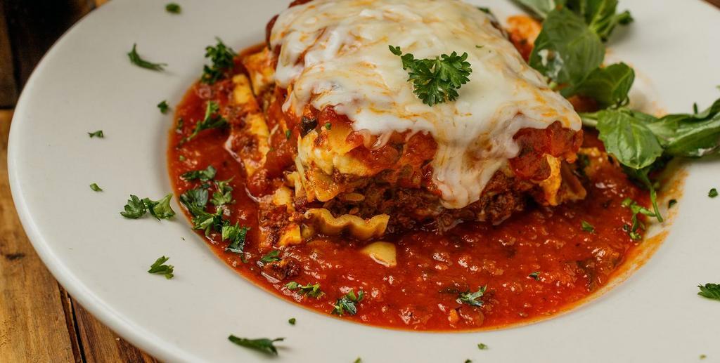 Neapolitan Lasagna Dinner · 3 cheese and meat lasagna in our homemade marinara sauce. Comes with your choice of tomato basil soup or salad and garlic bread. House or caesar salad 