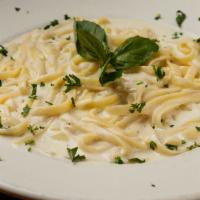 Fettuccine Alfredo Dinner · Fettuccine pasta tossed in our homemade Alfredo cream sauce. Comes with your choice of tomat...