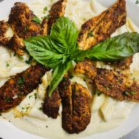 Penne Formaggio with Blackened Chicken Dinner · Penne pasta cooked in 3 cheese sauces (mozzarella, feta and Parmesan) topped off with blacke...