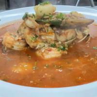 Cioppino · A combination of clams, shrimps, scallops, mussels, and whitefish in a fresh tomato white wi...