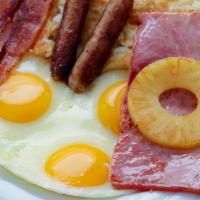 Big Breakfast Special · 3 extra-large eggs, 2 bacon strips, 2 sausage links, one slice of ham, pineapple ring, hashb...