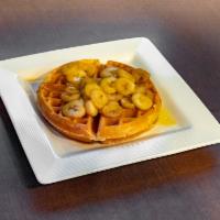 Bananas Foster Waffle  · Sliced & glazed banana over Belgian waffle, topped with whipped cream.