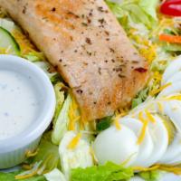 Grilled Salmon Salad · Chopped iceberg & romaine, tomato, cucumber, hard boiled egg, cheese, and choice of dressing.