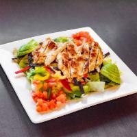 Southwest Chicken Salad · Chopped iceberg & romaine, grilled all-natural chicken, pico de gallo, sliced avocado, crisp...