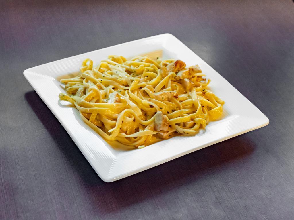 Chicken Alfredo  · Grilled all-natural chicken breast over fettuccini. Tossed in roasted garlic Alfredo.
