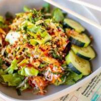 Saigon Salad · Seasonal herb, pickled carrot & daikon, basil, spicy candied peanut, cucumber, shallot crunc...
