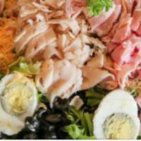 Chef Salad · Mixed greens topped with turkey, ham, tomato, hard-boiled egg, sliced black olives, cheddar,...
