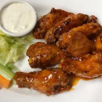 The Franklin Breaded Wings · Served with bleu cheese, celery and carrots. Breaded jumbo chicken wings fried golden brown ...