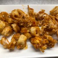Cajun Crispy Calamari · Fried golden brown calamari tossed in our homemade Cajun sauce.
