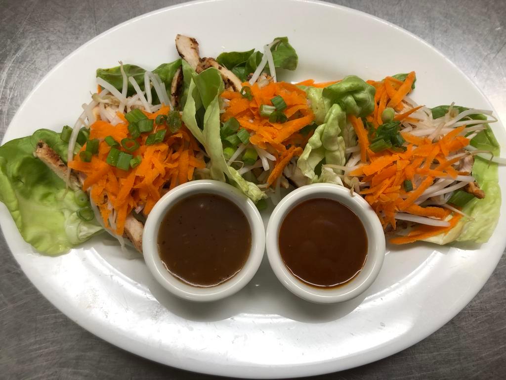 Thai Lettuce Wraps Salad · Strips of grilled chicken breast, bean sprouts, shredded carrots, served on
Boston bibb lettuce leaves with 2 delicious dipping sauces, spicy Asian and Thai peanut.
