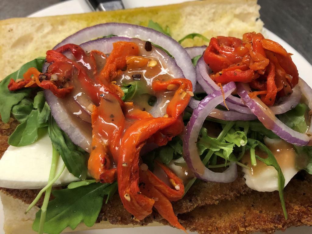 Incredible Eggplant Sandwich · Breaded eggplant, roasted peppers, red onions, organic baby arugula,
fresh mozzarella on toasted garlic bread with balsamic vinaigrette.