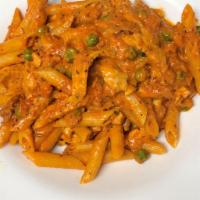 Penne ala Vodka · Pencil point pasta, peas and prosciutto in a creamy pink sauce. Add chicken or shrimp for an...