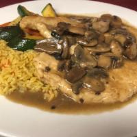 Chicken Marsala · Chicken breast sauteed in a mushroom and Marsala wine sauce served with seasoned rice and sa...