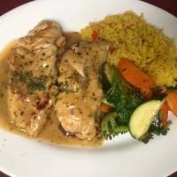 Charlie's Spicy Chicken · Tenderloins sauteed in a spicy white wine and garlic sauce served with seasoned rice and sau...