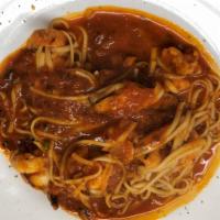 Shrimp Beeps Over Linguine · Jumbo shrimp sauteed in spicy tomato sauce served over linguine with garlic bread.