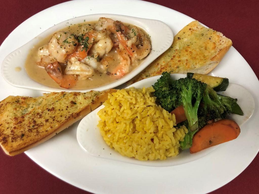 Shrimp Scampi · Jumbo shrimp sauteed in extra virgin olive oil and garlic sauce with seasoned rice, sauteed fresh vegetables, garlic bread.